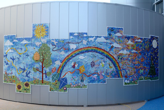 mosaic mural with rainbow and kites