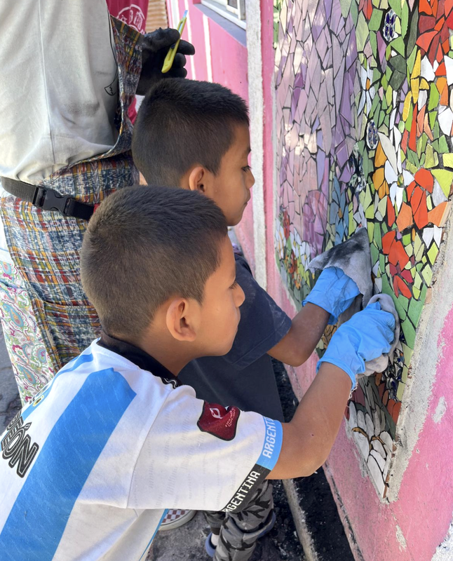 boys grouting mosaic guatemala